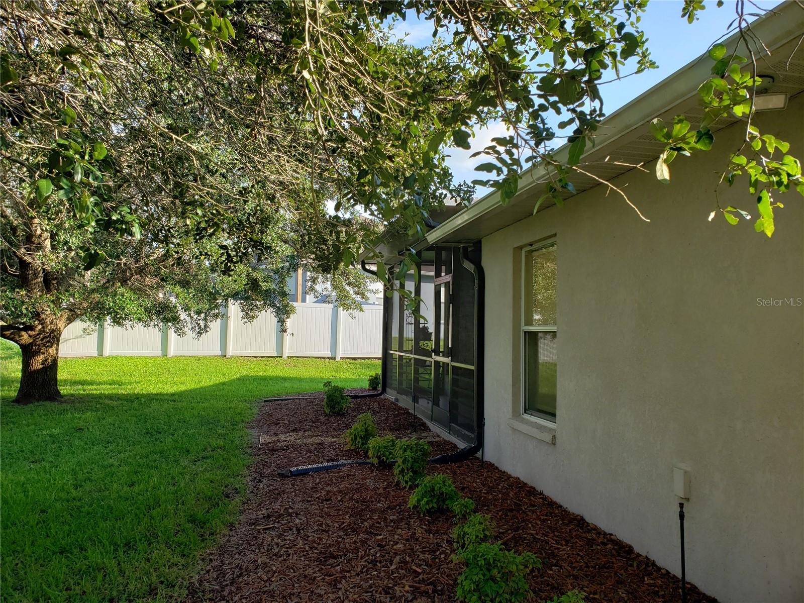 Shrub Beds Behind House & Screen Room