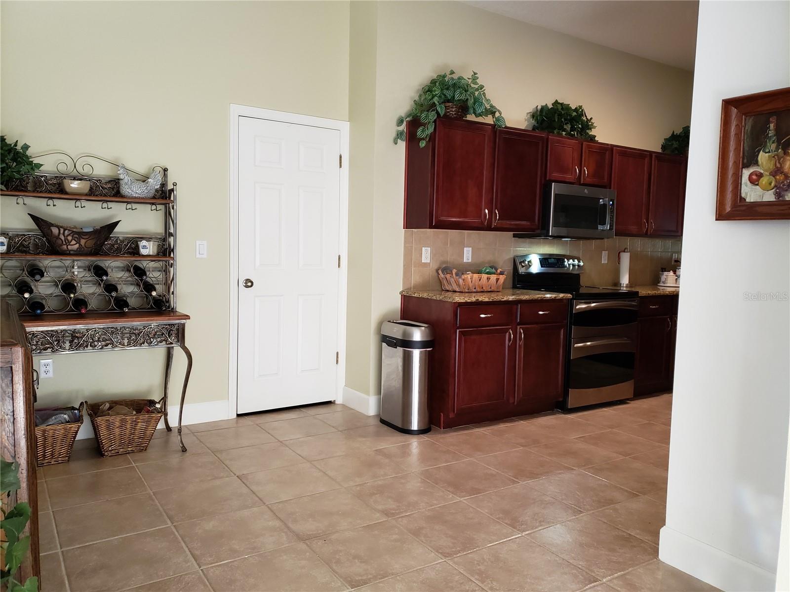 Looking into 'Eat-In' Area of Kitchen toward the Laundry Area Beyond