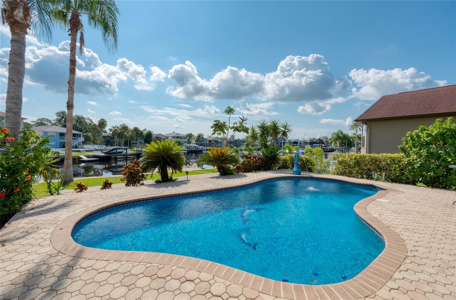 Neutral pavers compliment this pool