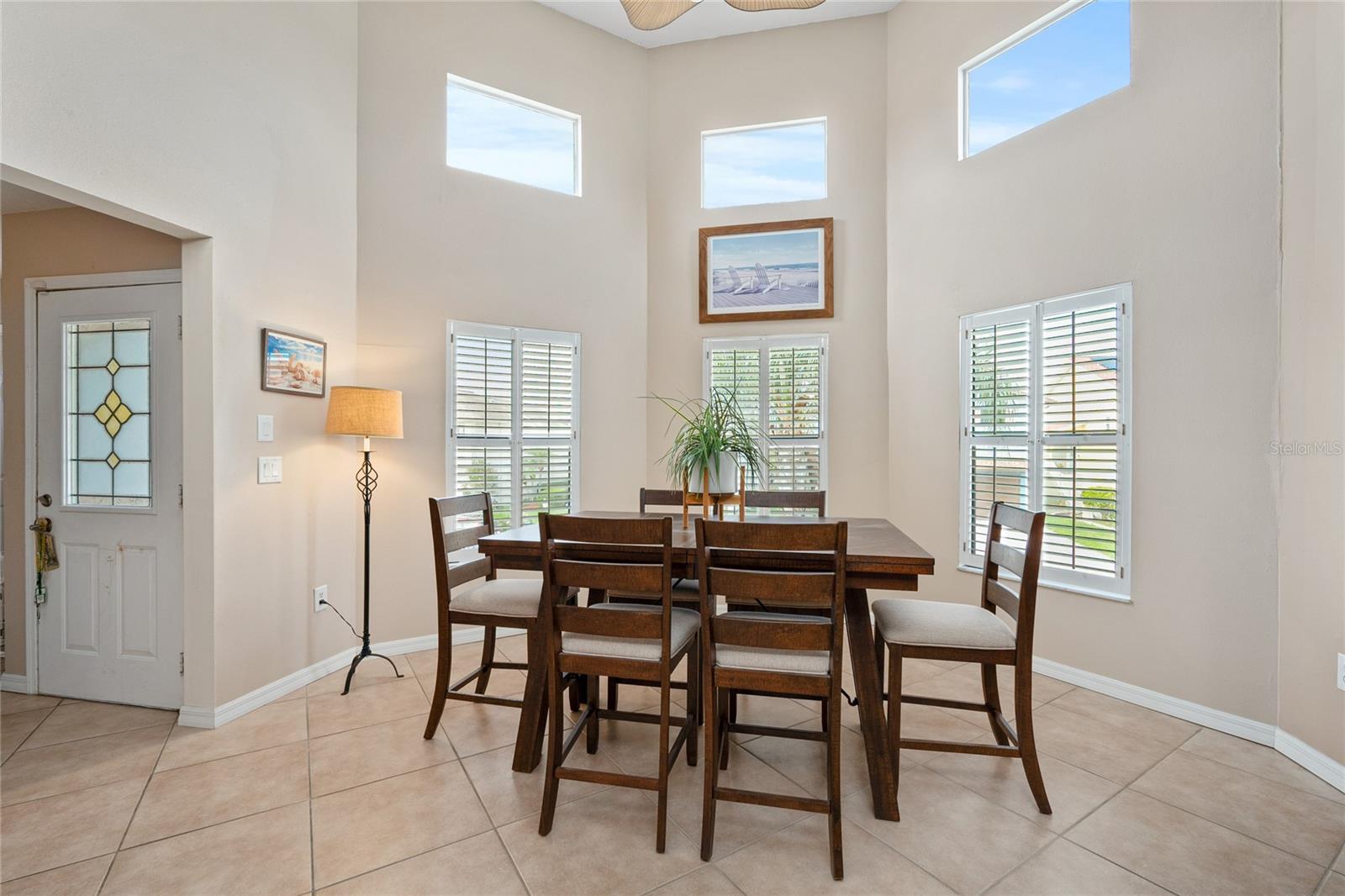 The Cathedral ceiling makes this dining space even more lovely