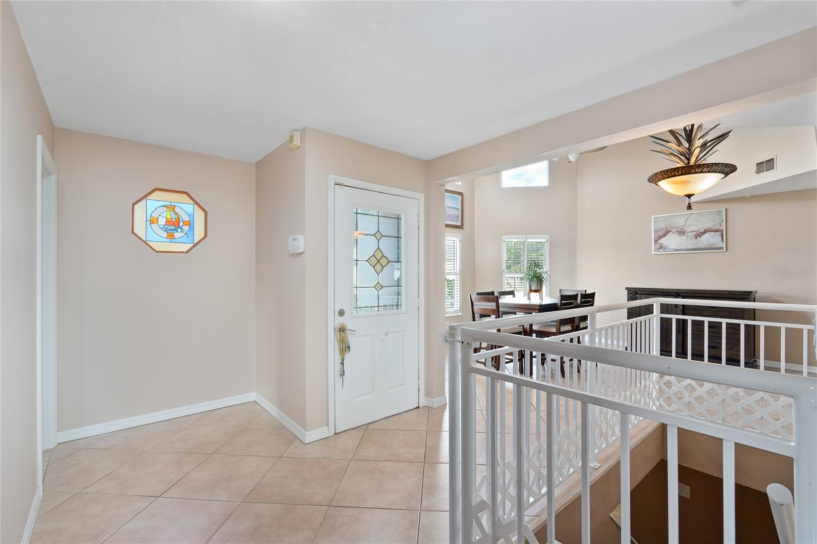 View of the entrance into the home and the stairs leading to the ground floor