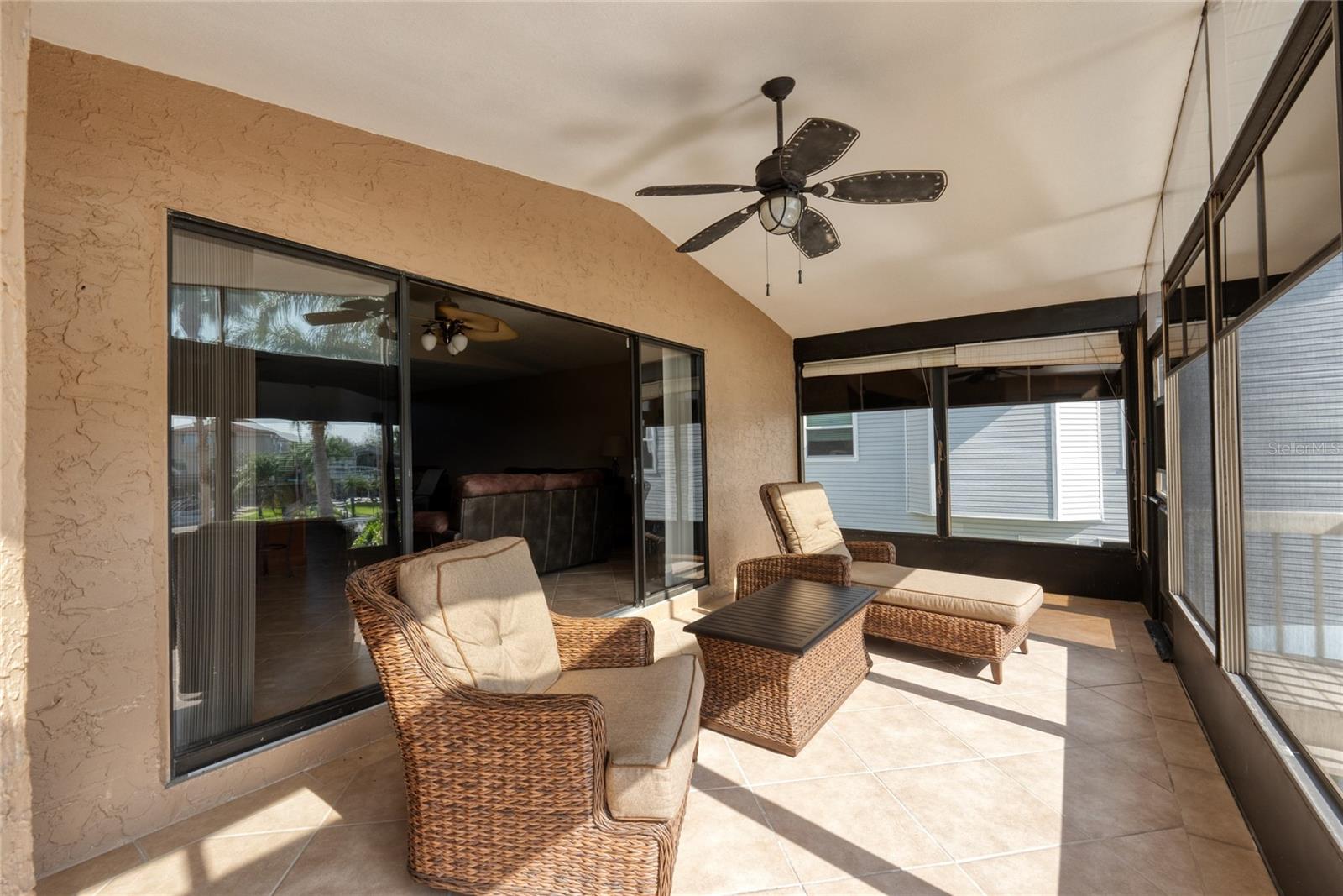 Florida room with sliders and access to the pool deck