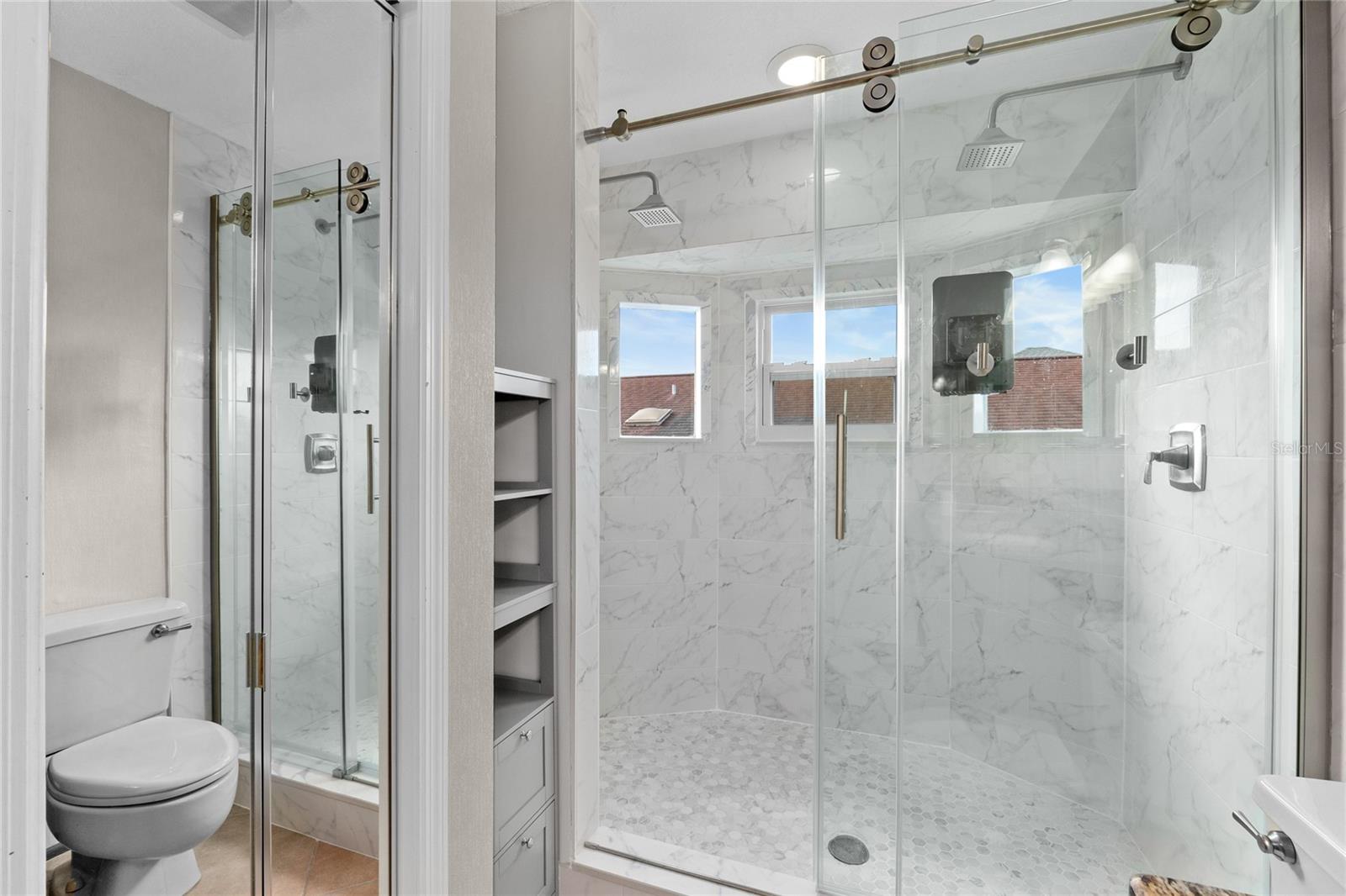 Gorgeous NEW Tile and windows in this Master Bathroom