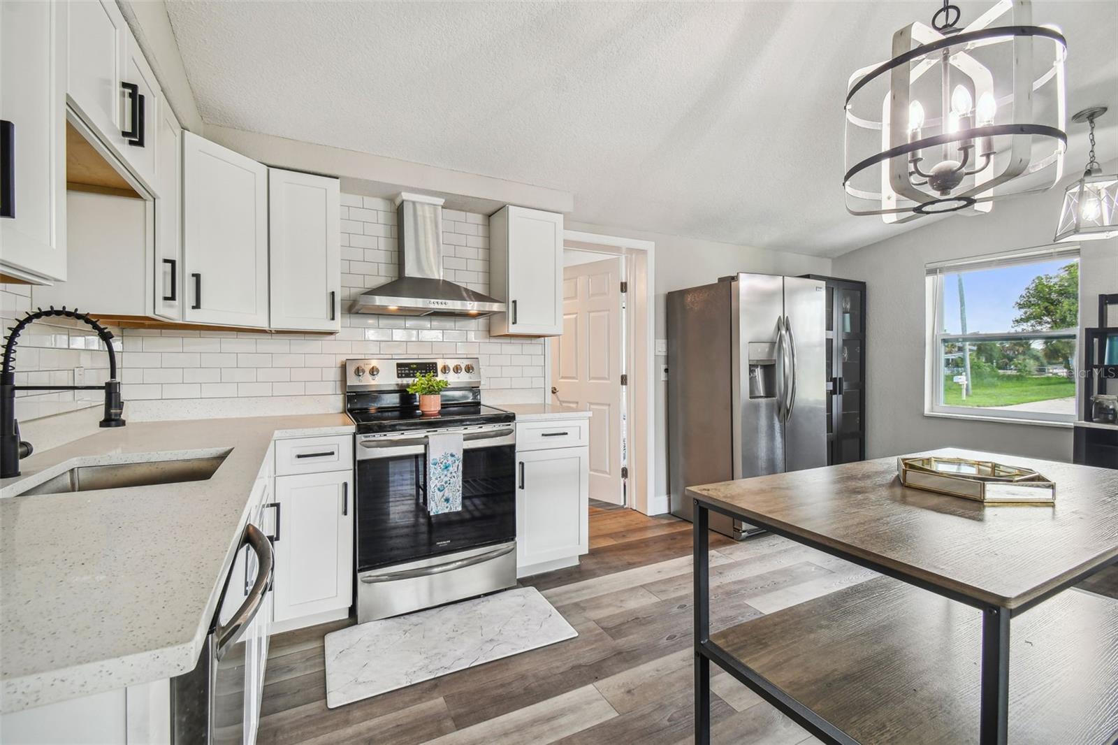 look at those sparkling quartz countertops and hand selected faucet