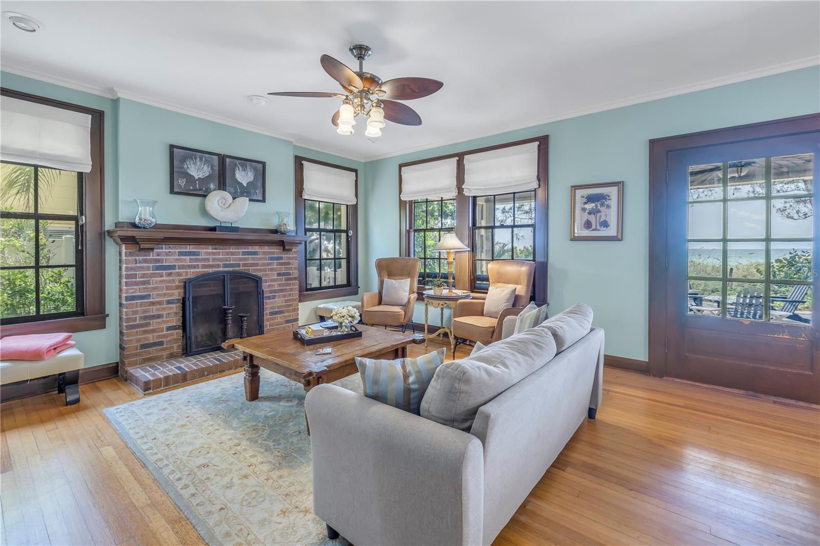 Living room w/ wood burning fireplace