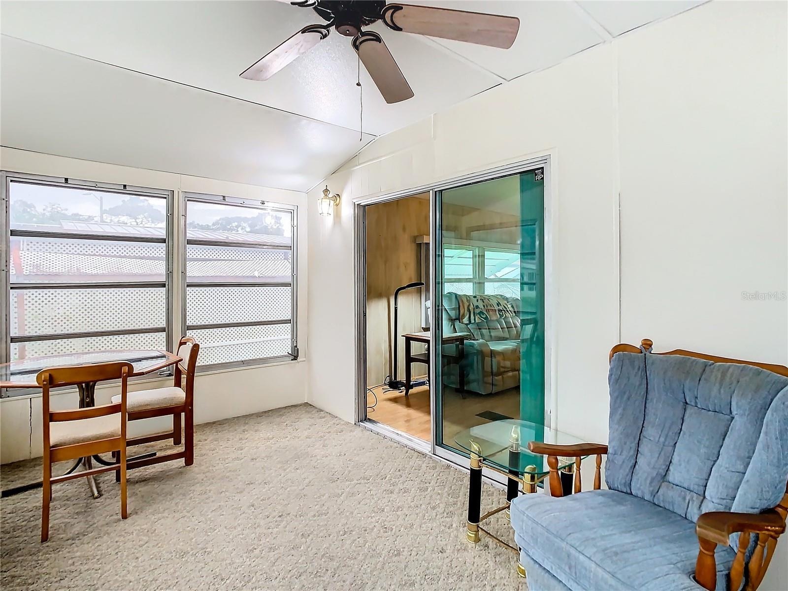 Sunroom with window AC unit.