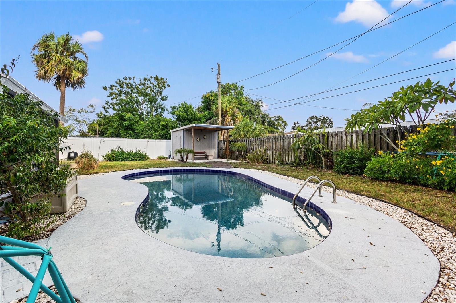 Large yard with storage shed and outdoor porch