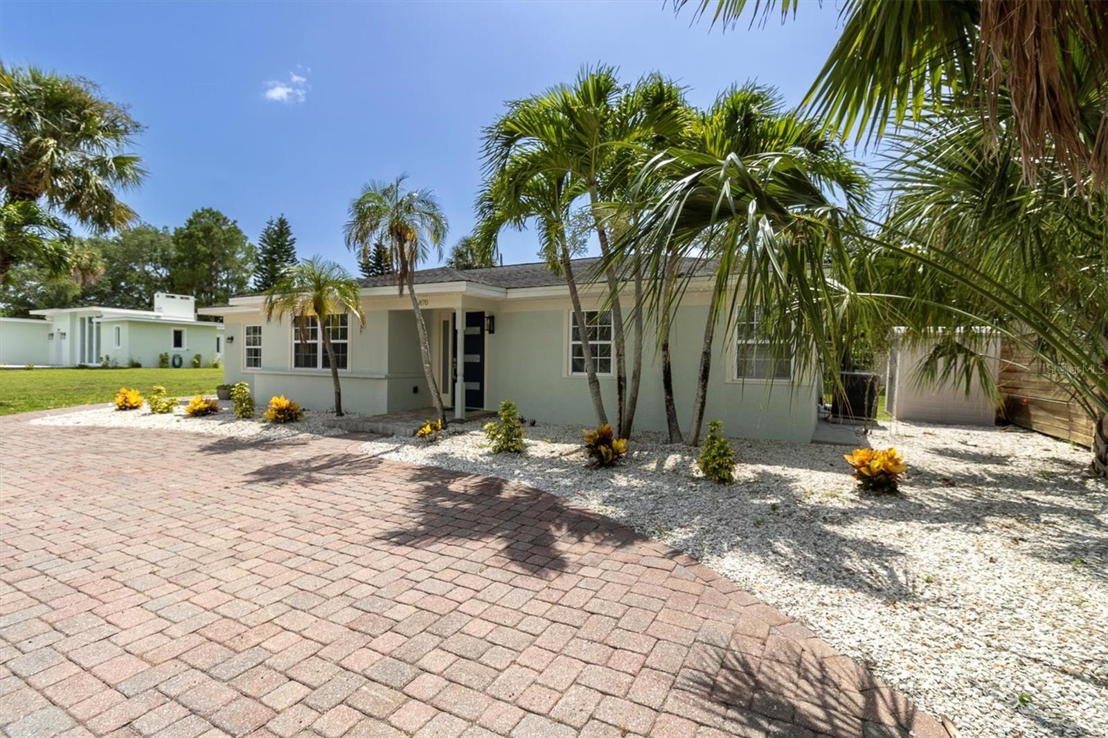 Front view with brick paver circular driveway