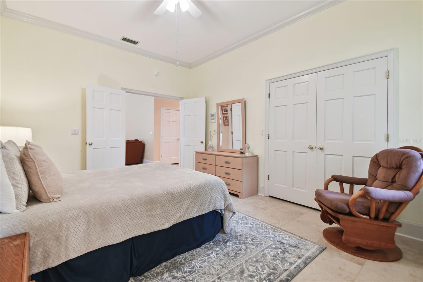 Downstairs bedroom with ensuite and walk-in closet.