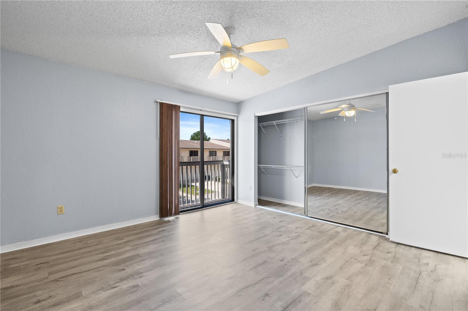 Primary bedroom with balcony