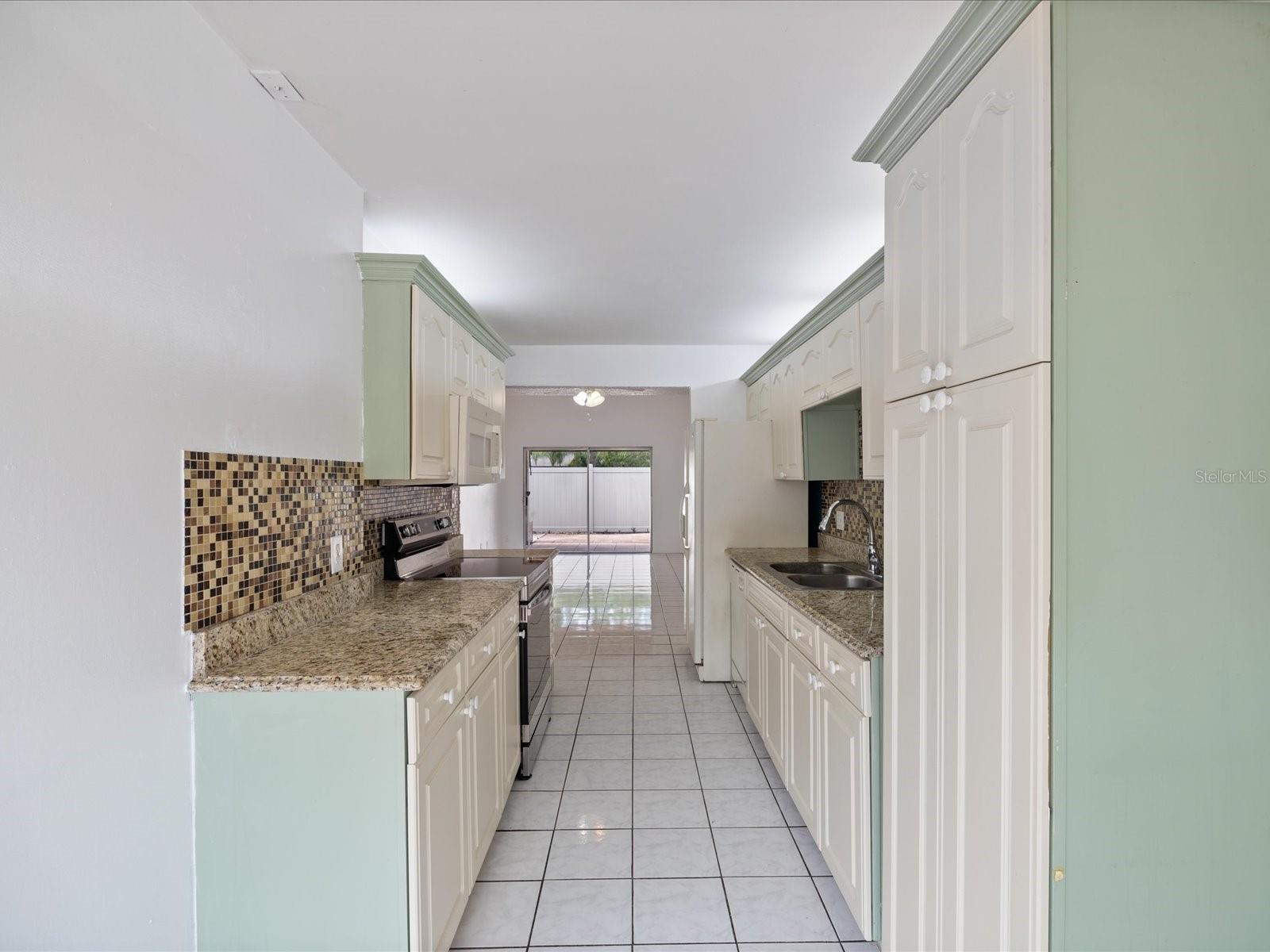 From eat-in kitchen space looking towards kitchen