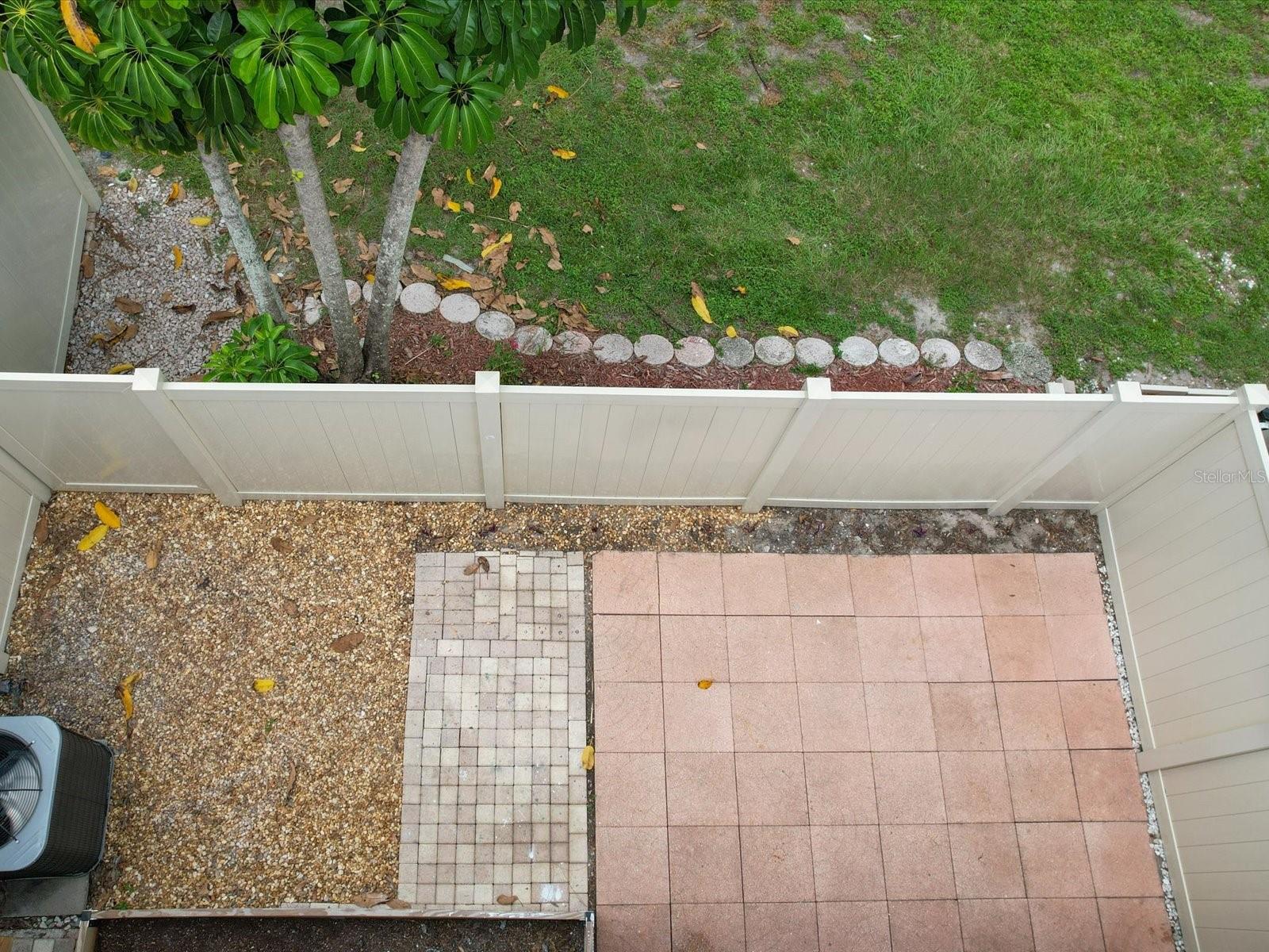 Aerial view of large private back patio space