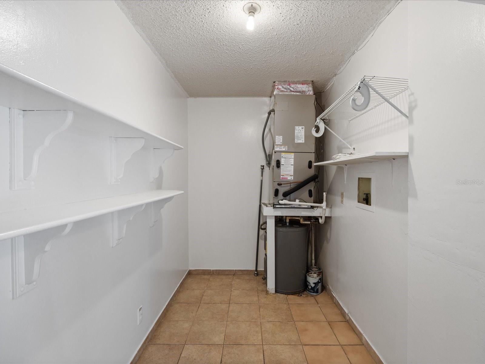 Oversized laundry room with washer & dryer hook ups