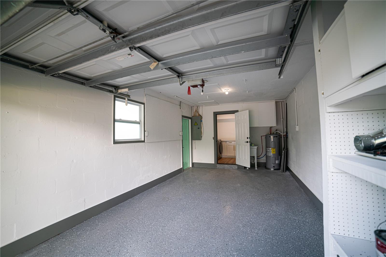 1 Car Garage with Extra Storage leading to Laundry room