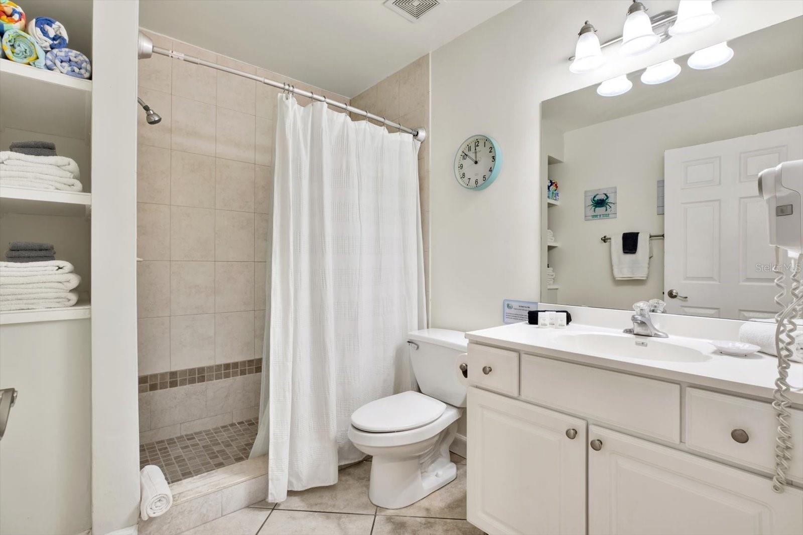 Bathroom with plenty of storage for beach and pool towels!