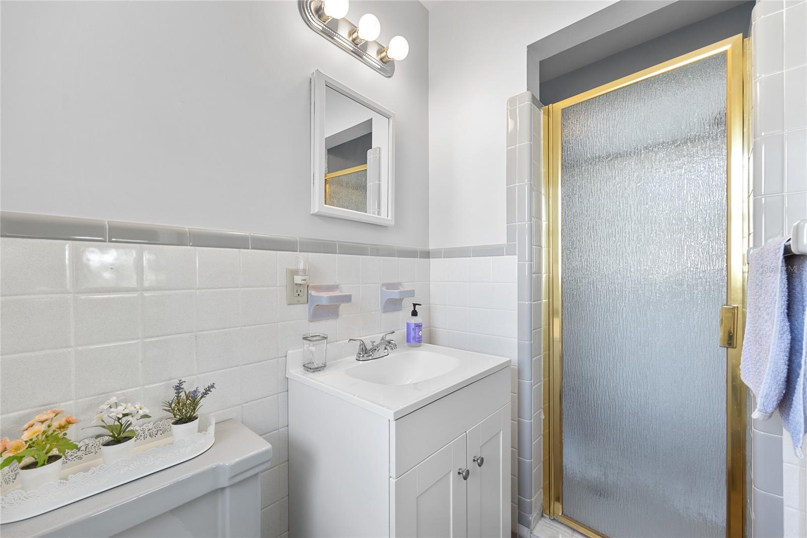 This charming vintage bathroom in the Master Suite could be expanded into the bedroom to create a more luxurious space and still leave you with a large Bedroom.