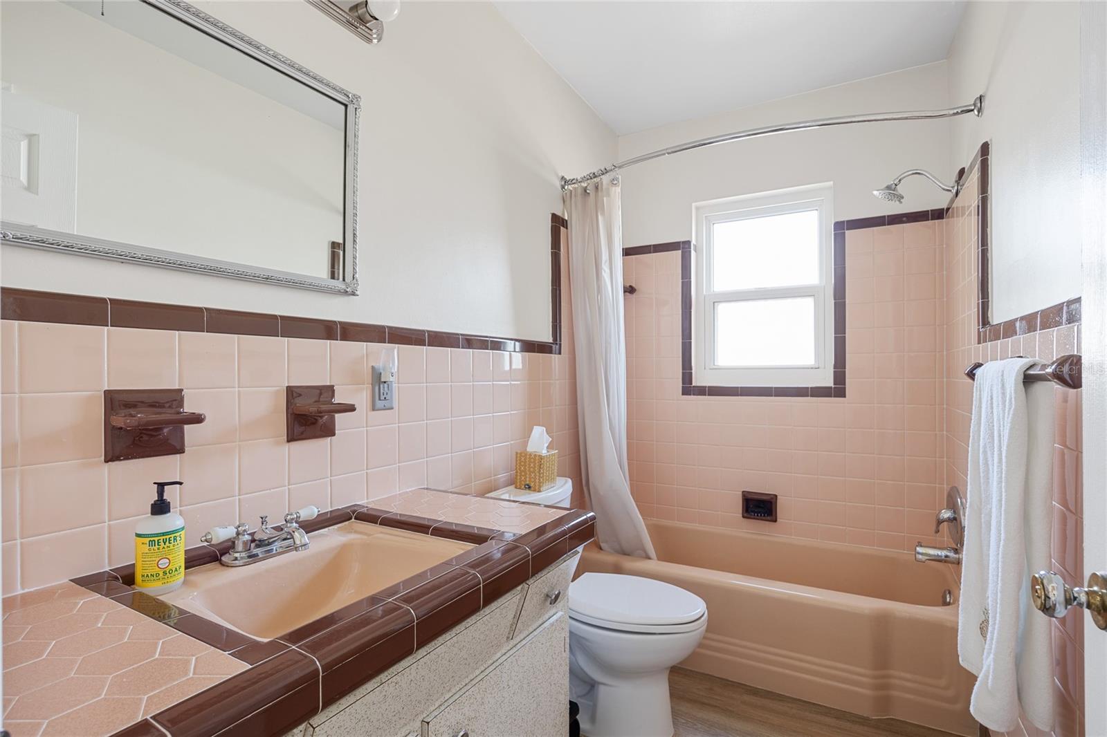 Bathroom #2 features lovely vintage tile and a shower/tub combo and is convenient for your guests to use.