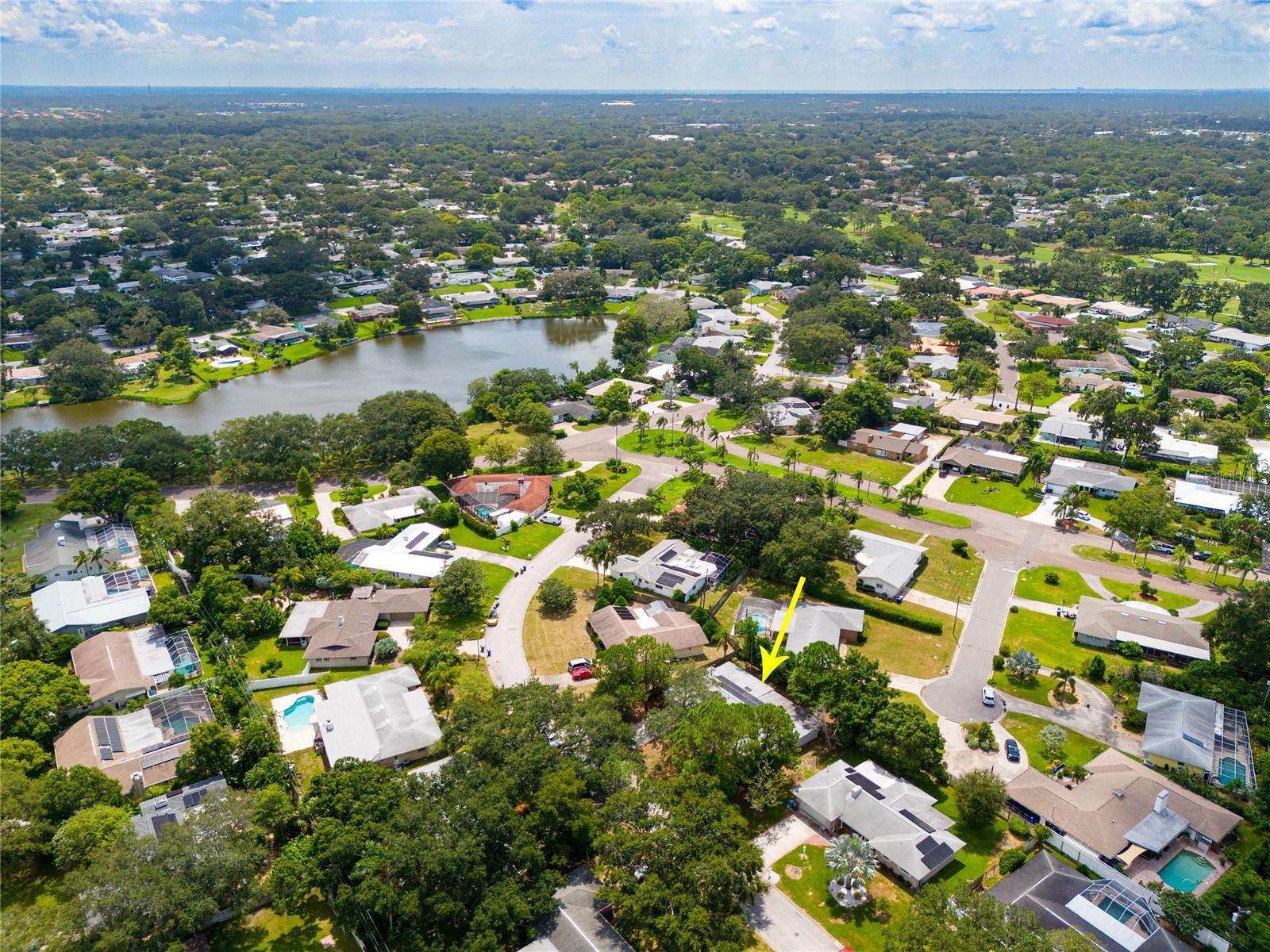 This aerial view shows beautiful Lake Saundra at the Heart and center of Fairway Estates.