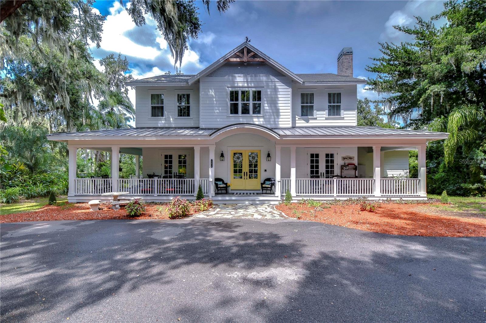 Modern Farmhouse style main house w/wrap around porch