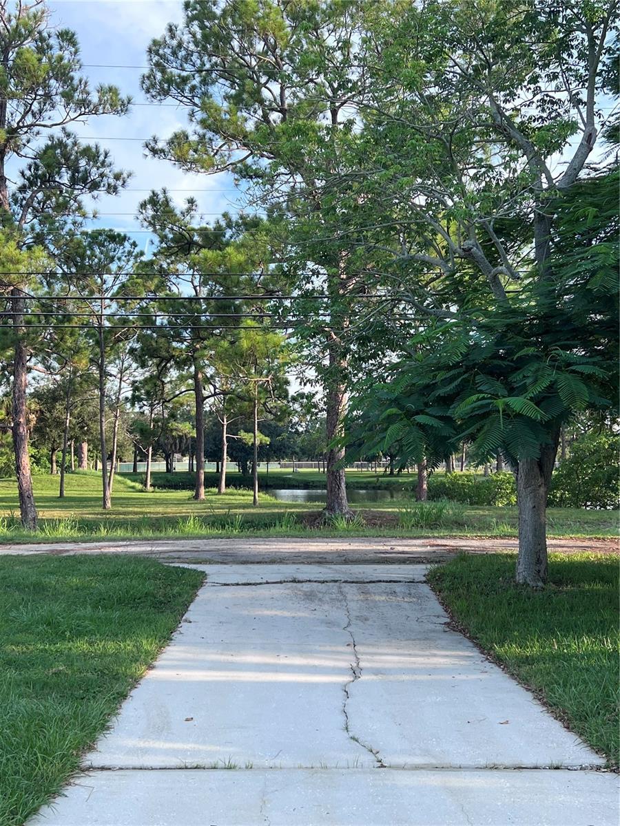 Beautiful pond view of Fossil Park from your backyard