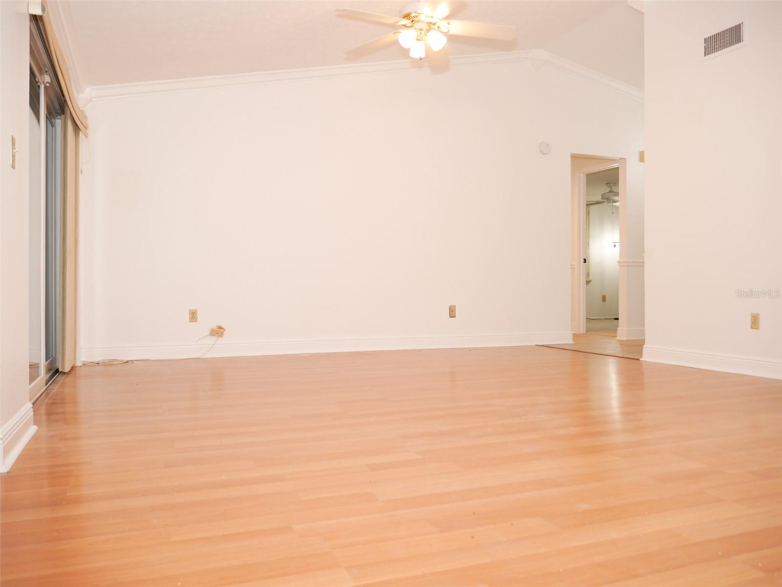 Crown molding and warm wood look flooring