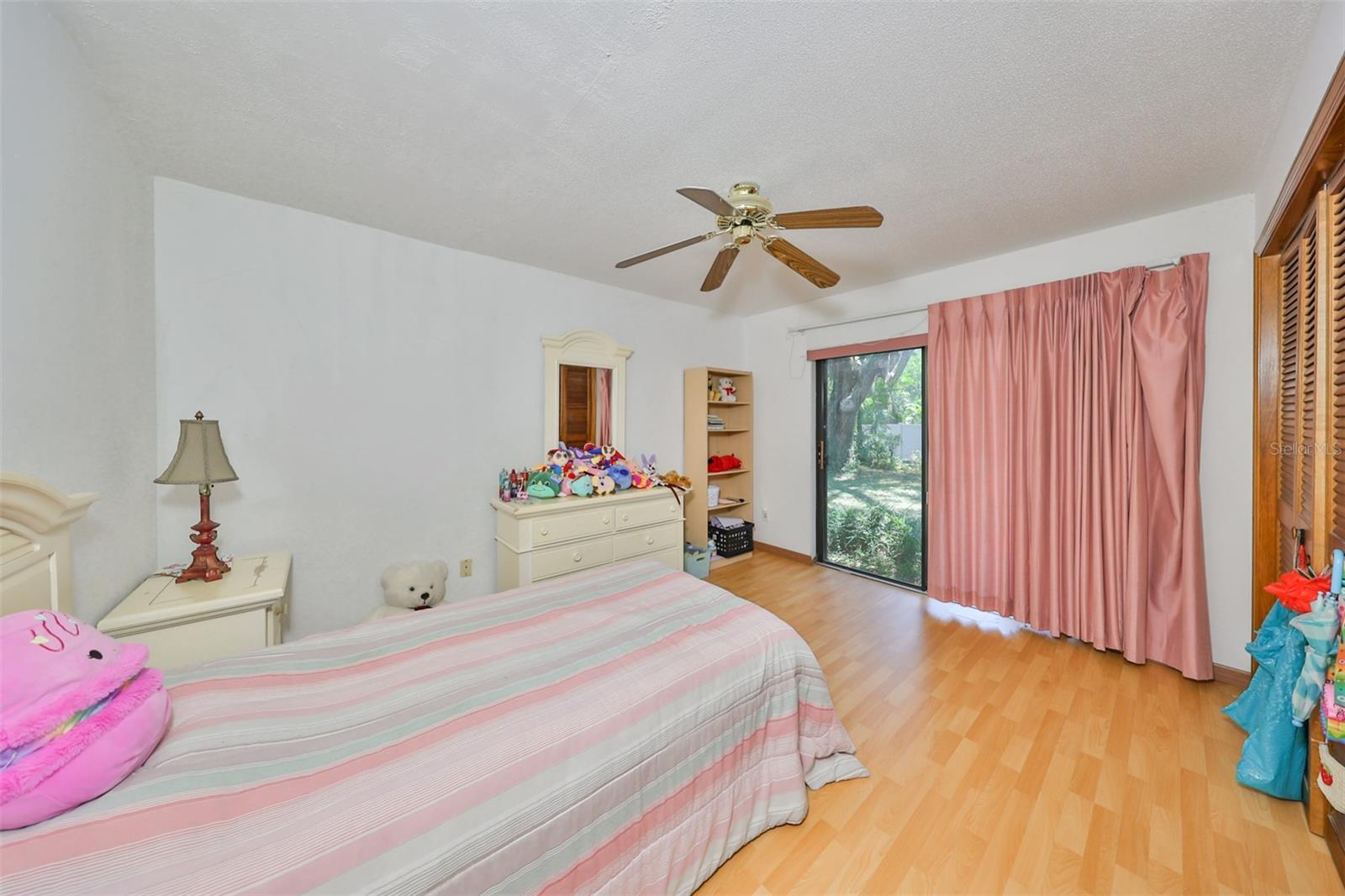 Bedroom #4 is good size and bright with the sliding glass doors