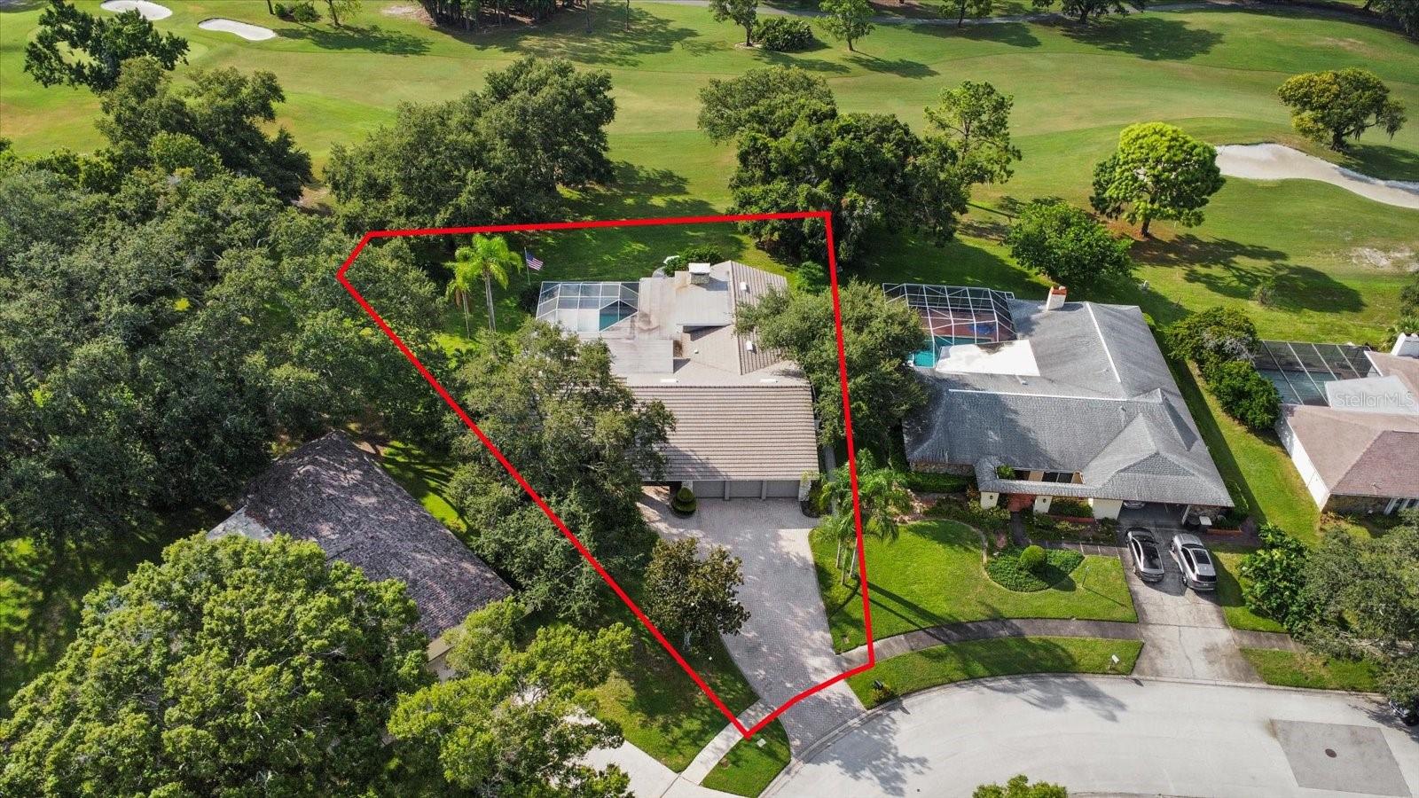 Aerial View of the front of home and gorgeous golf course right behind it.