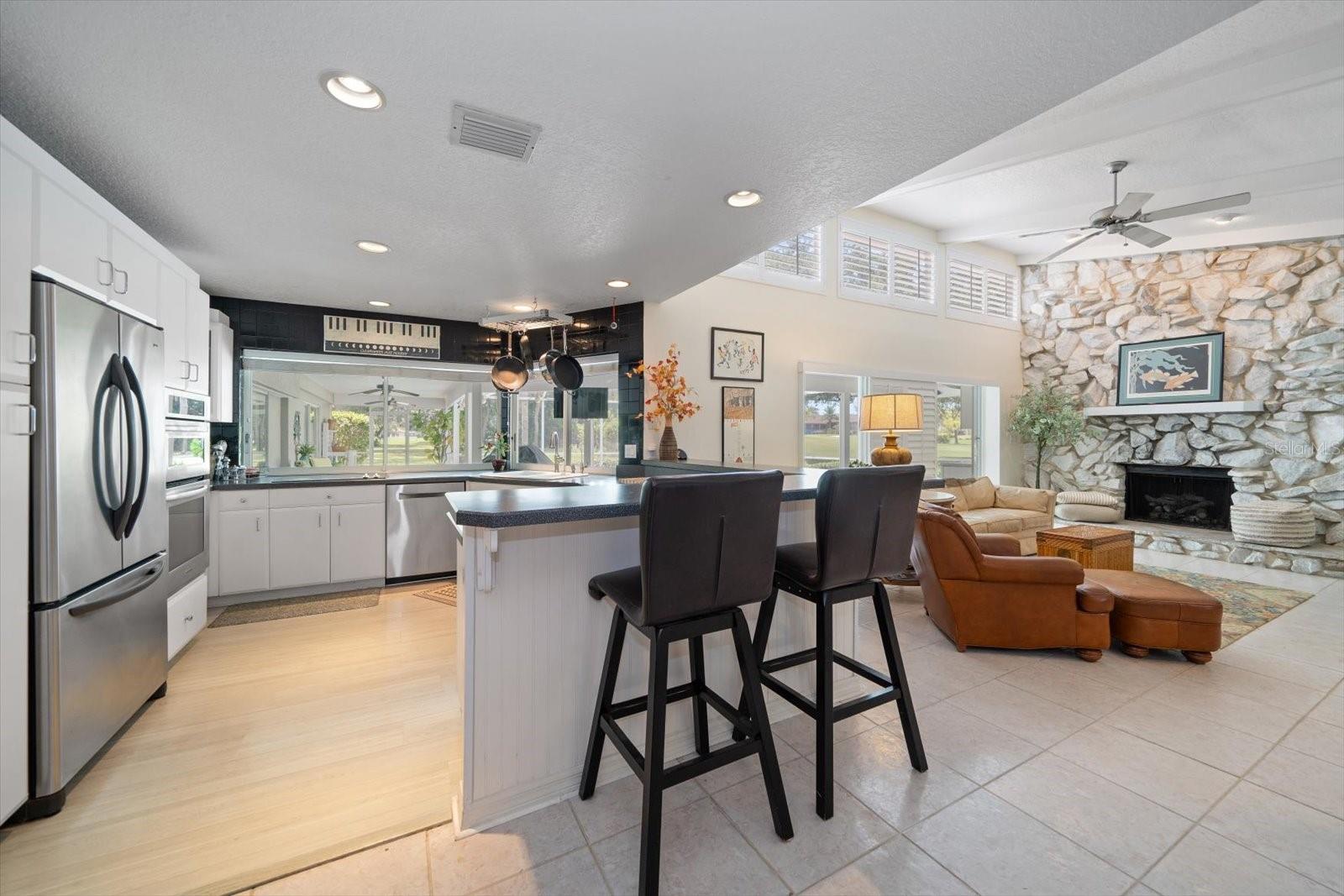 Open concept kitchen with bar stool seating.