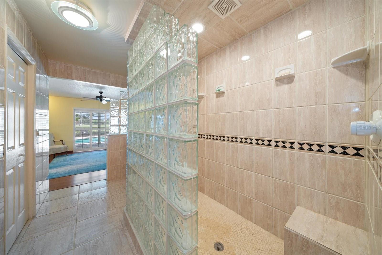 Spacious primary bathroom shower.