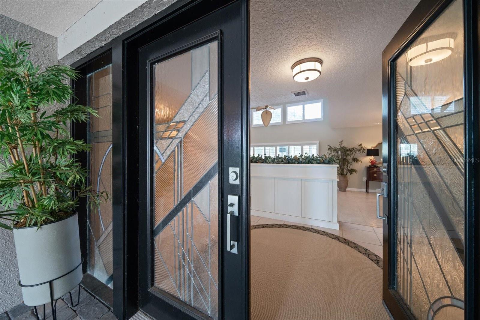 Custom leaded glass double door entry.