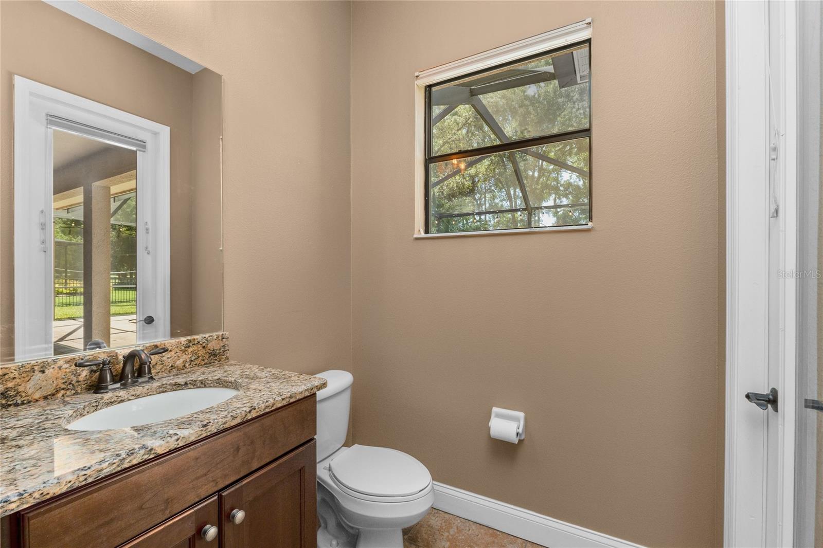 1/2 bath with access from the Screened in Lanai