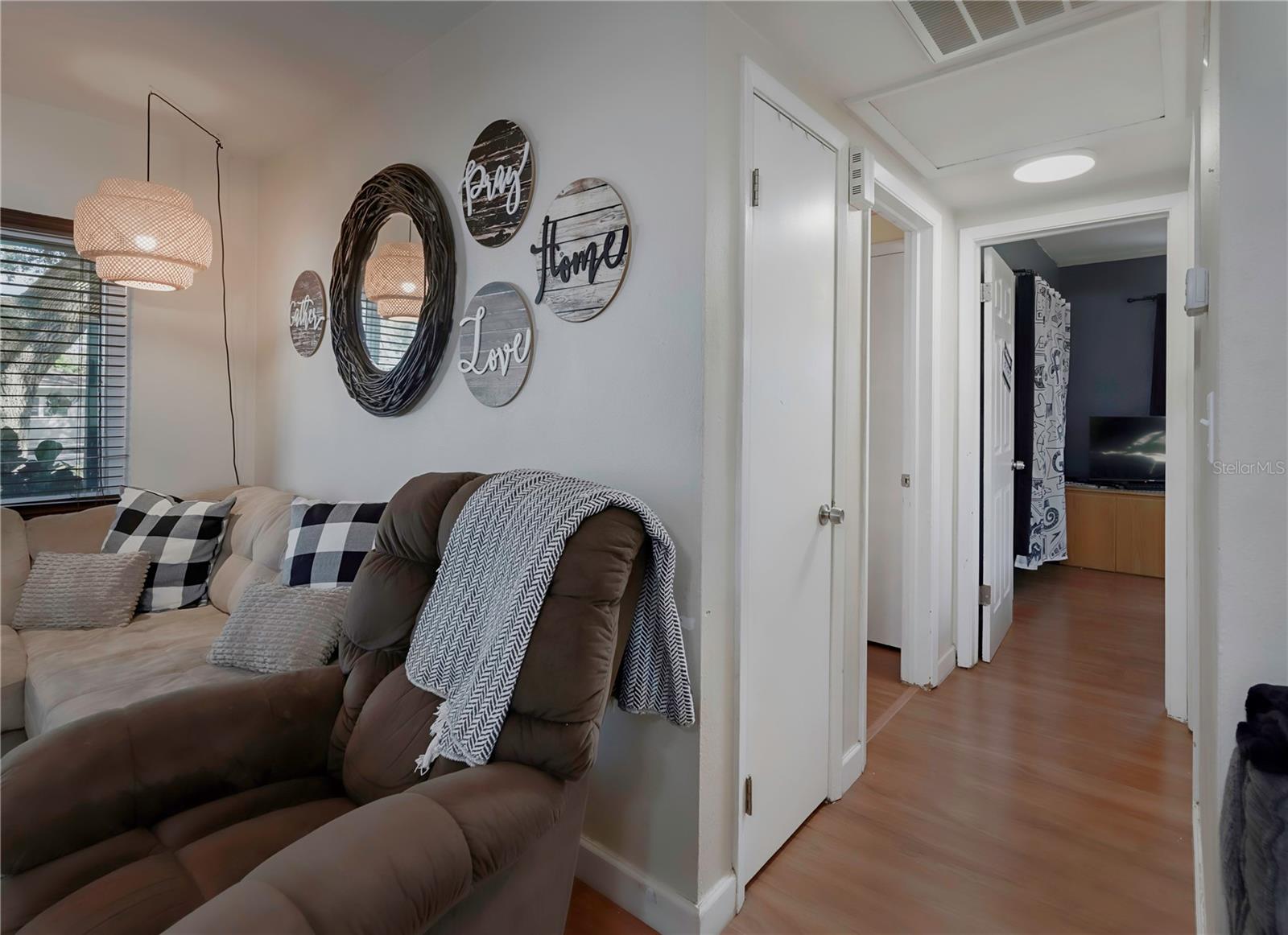 Hallway to second and third bedrooms.