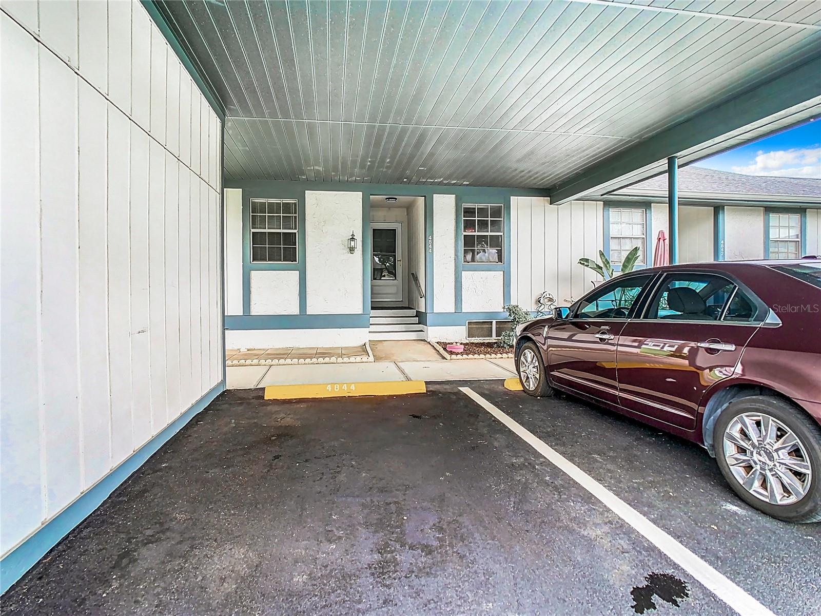 Assigned carport Parking Spot #1 and locked storage unit to the left