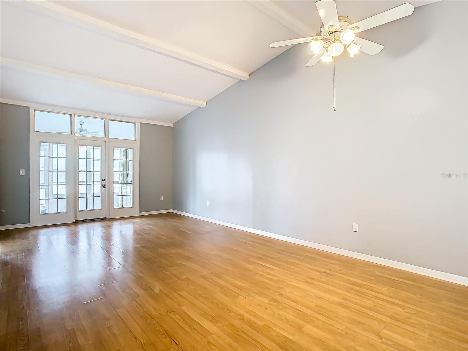 large living room with vaulted ceiling