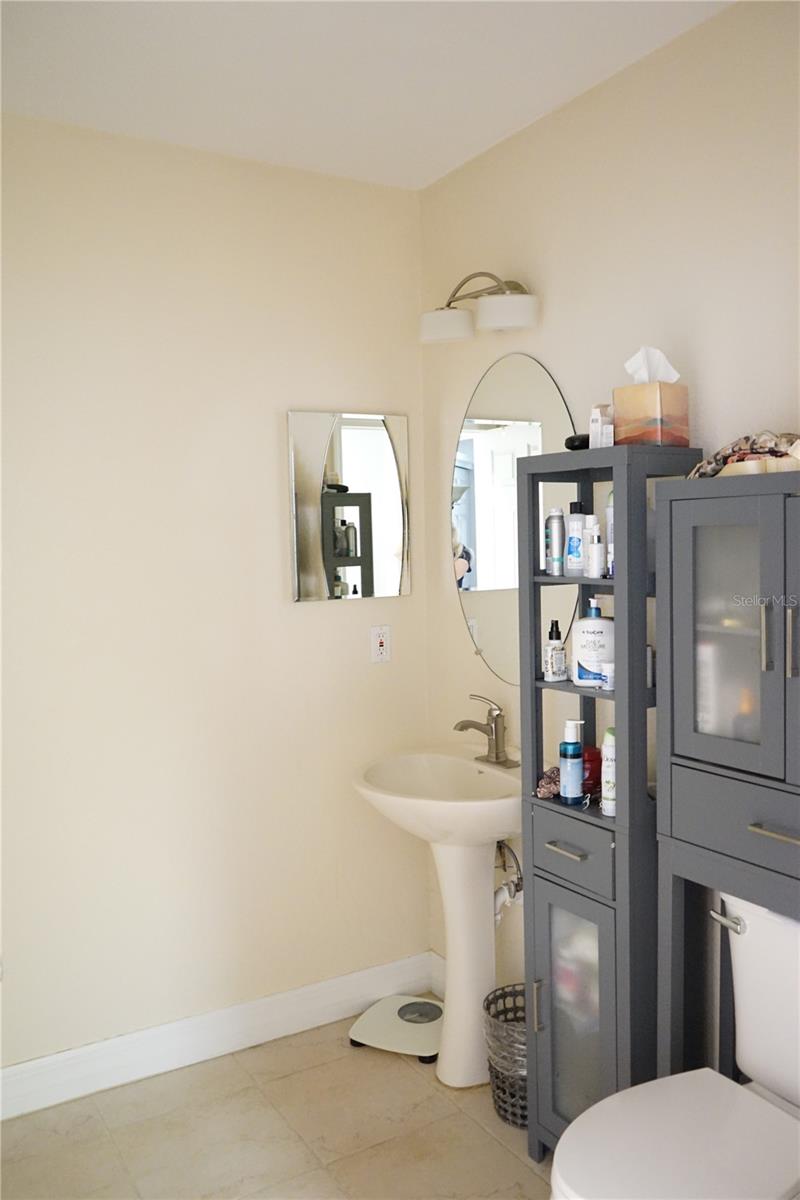 hall bath with pedestal sink