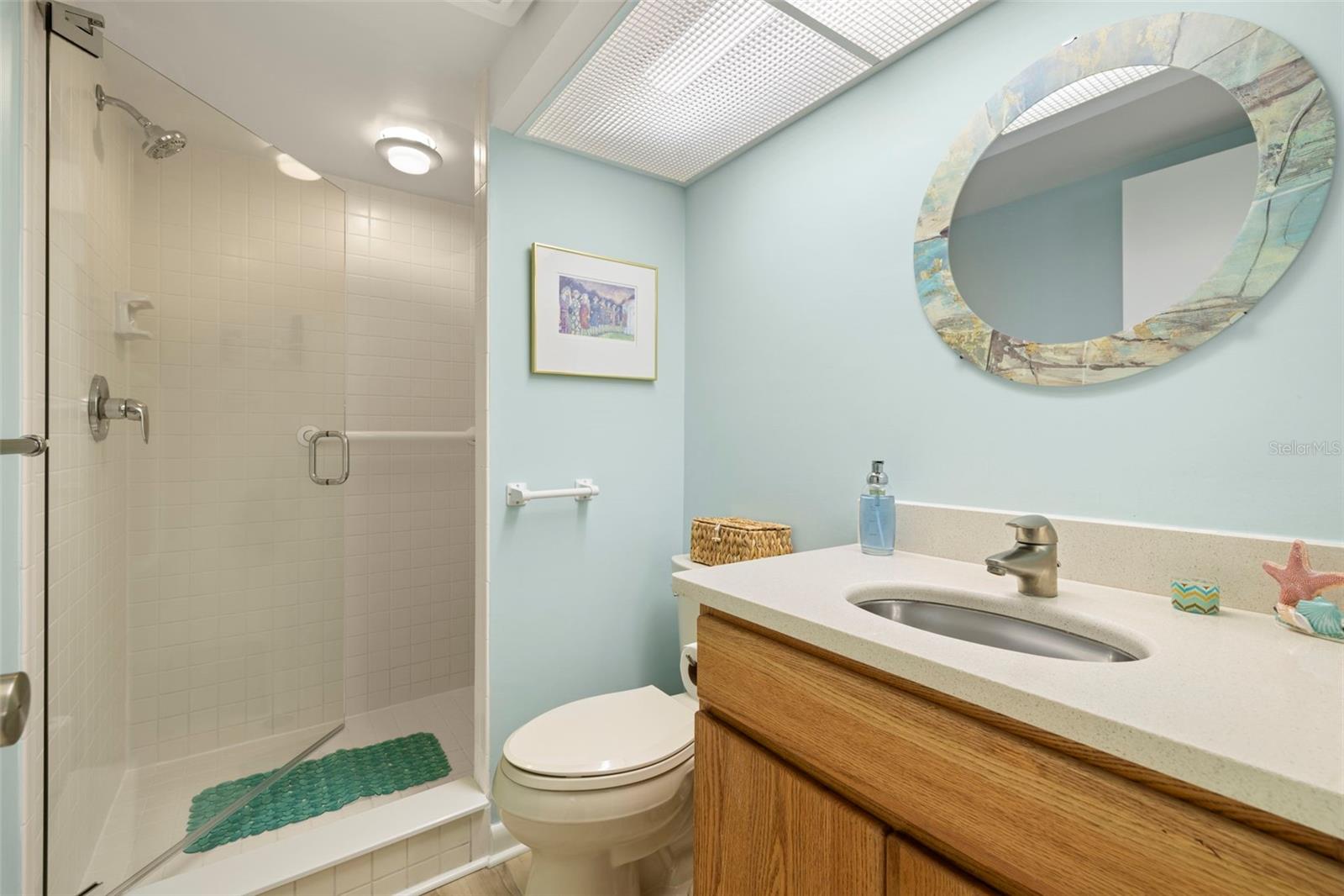 Guest bathroom has a spacious walk in shower