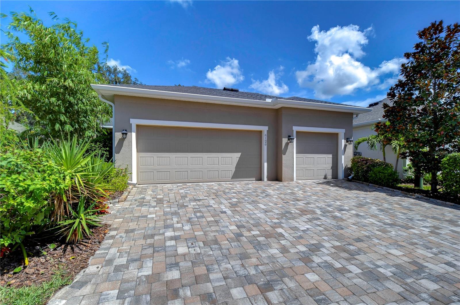 3 car garage with pavered driveway!