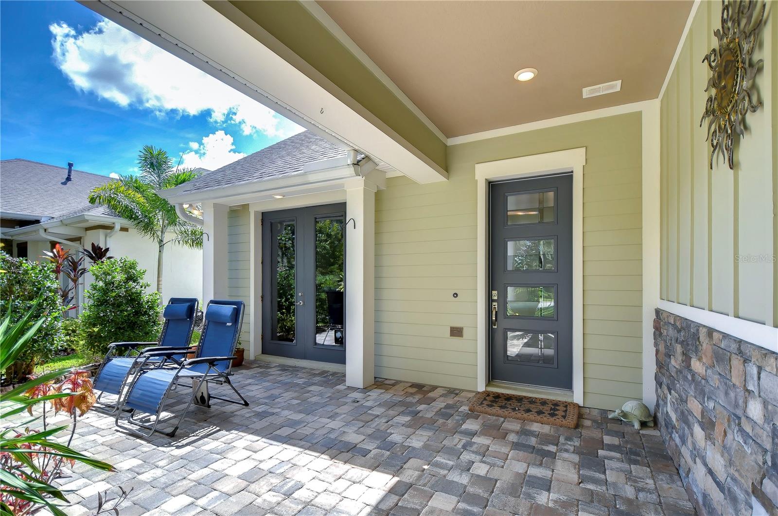 Front entrance with pavers with siting area!