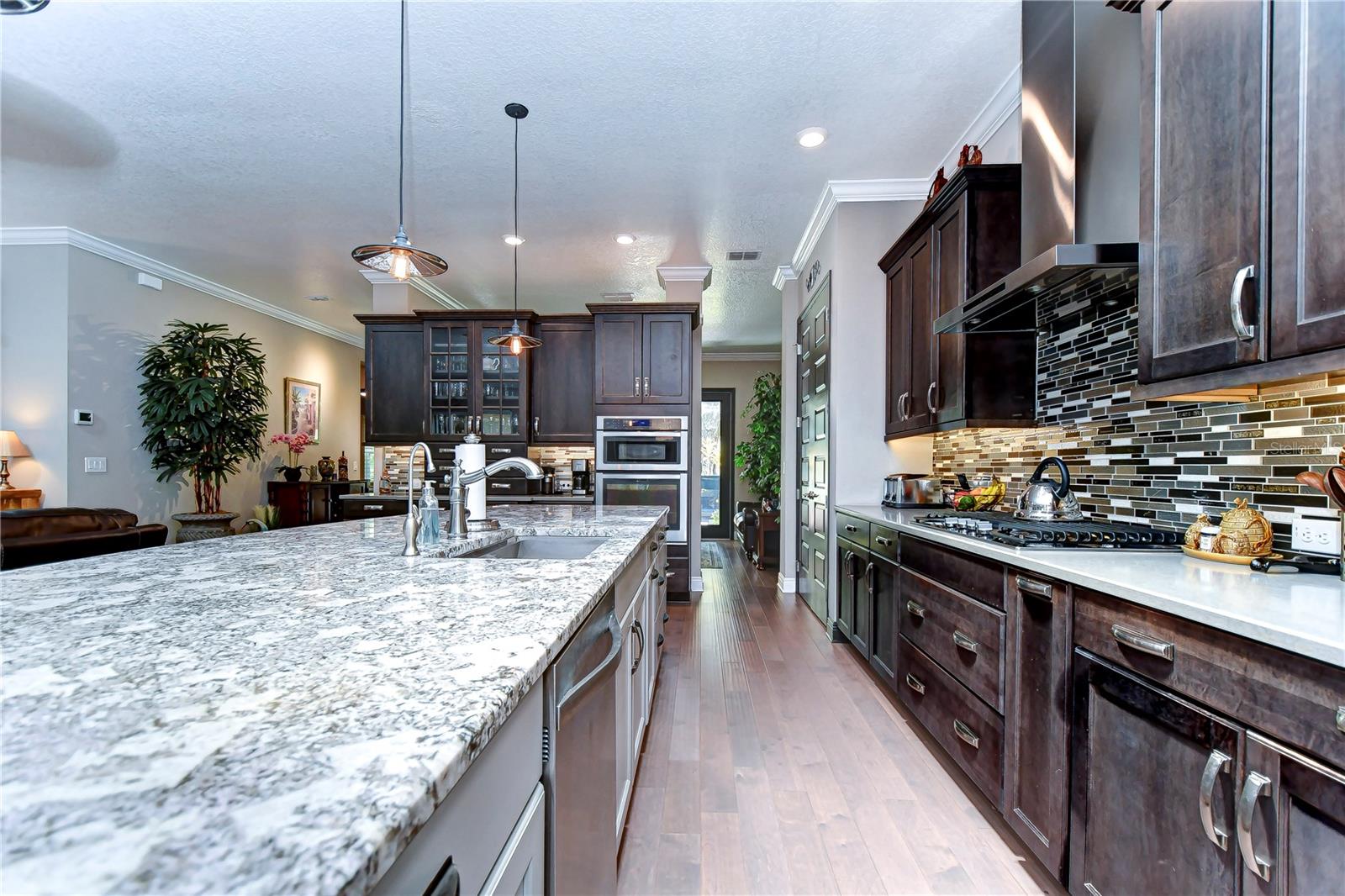 Kitchen with soft-close wood cabinets, under-cabinet lighting & granite counters!