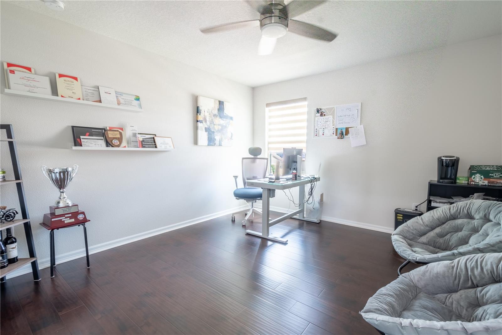 Bedroom 3 features wood laminate flooring, a ceiling fan with light kit, and a built-in closet.