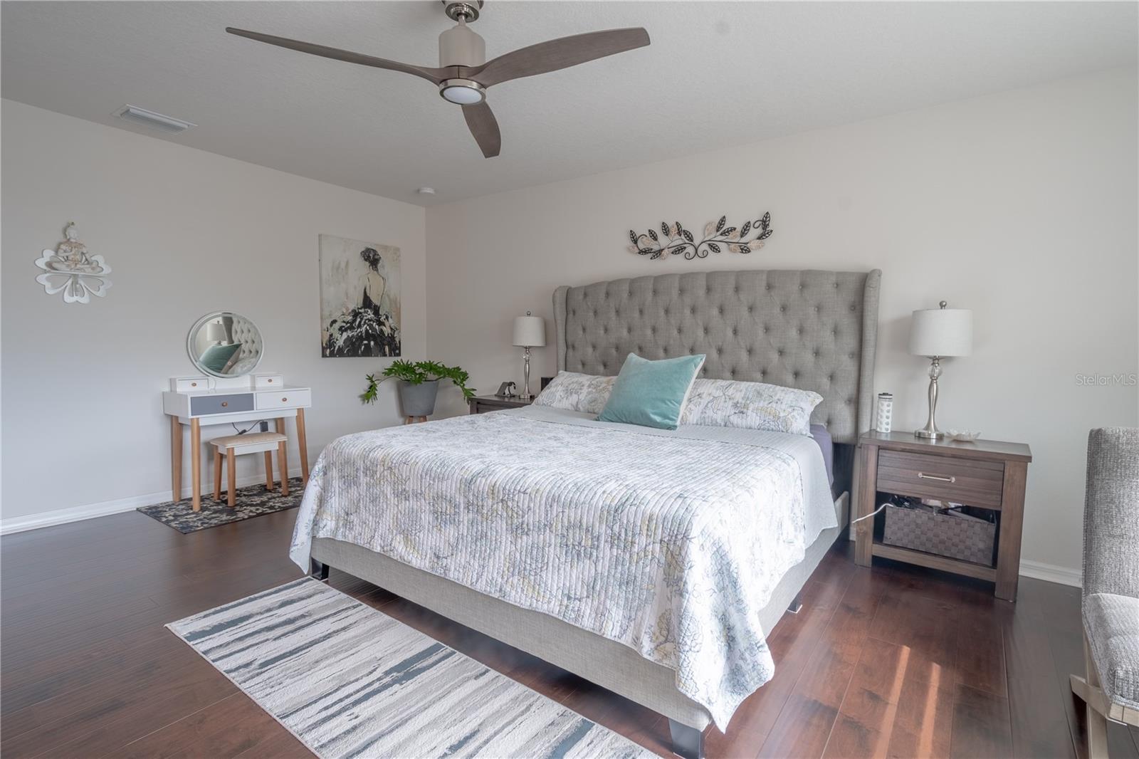 The primary bedroom features a modern 3 blade ceiling fan with remote control.