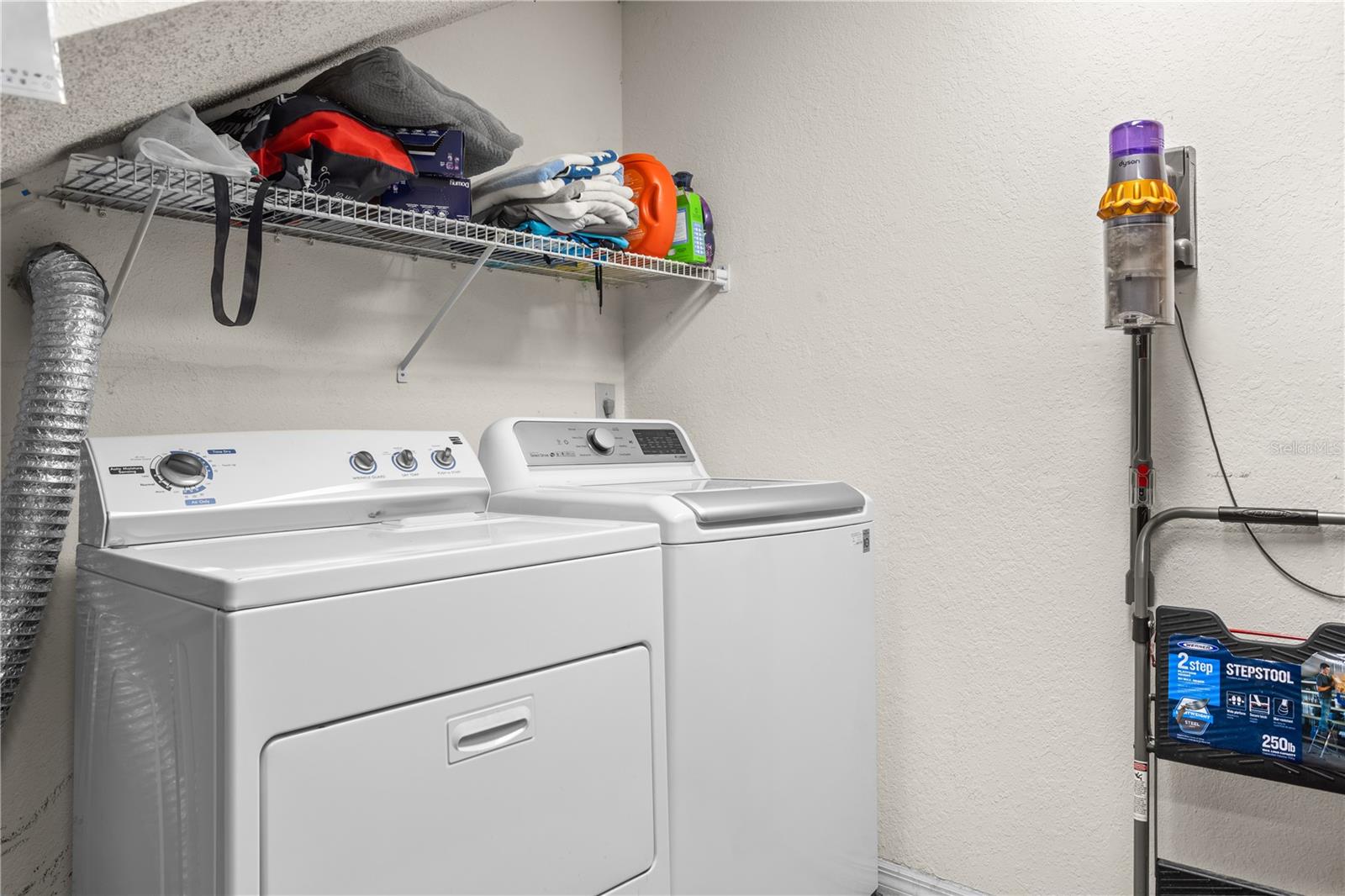 The washer and dryer is conveniently located in the garage.