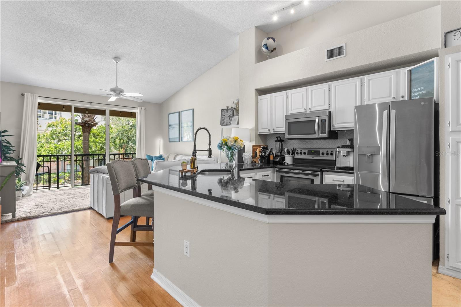 The spacious kitchen sits in the middle of the living area.