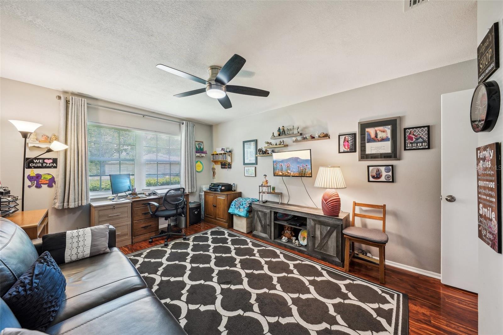 Guest bedroom.  Notice matching fan/light fixtures throughout.