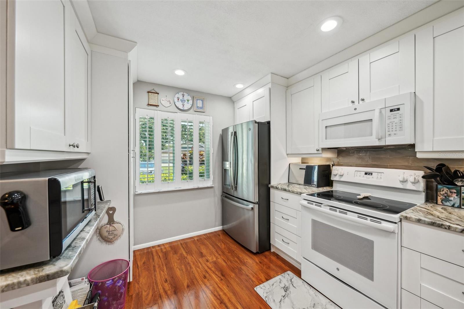 Solid wood cabinets and recessed lighting.