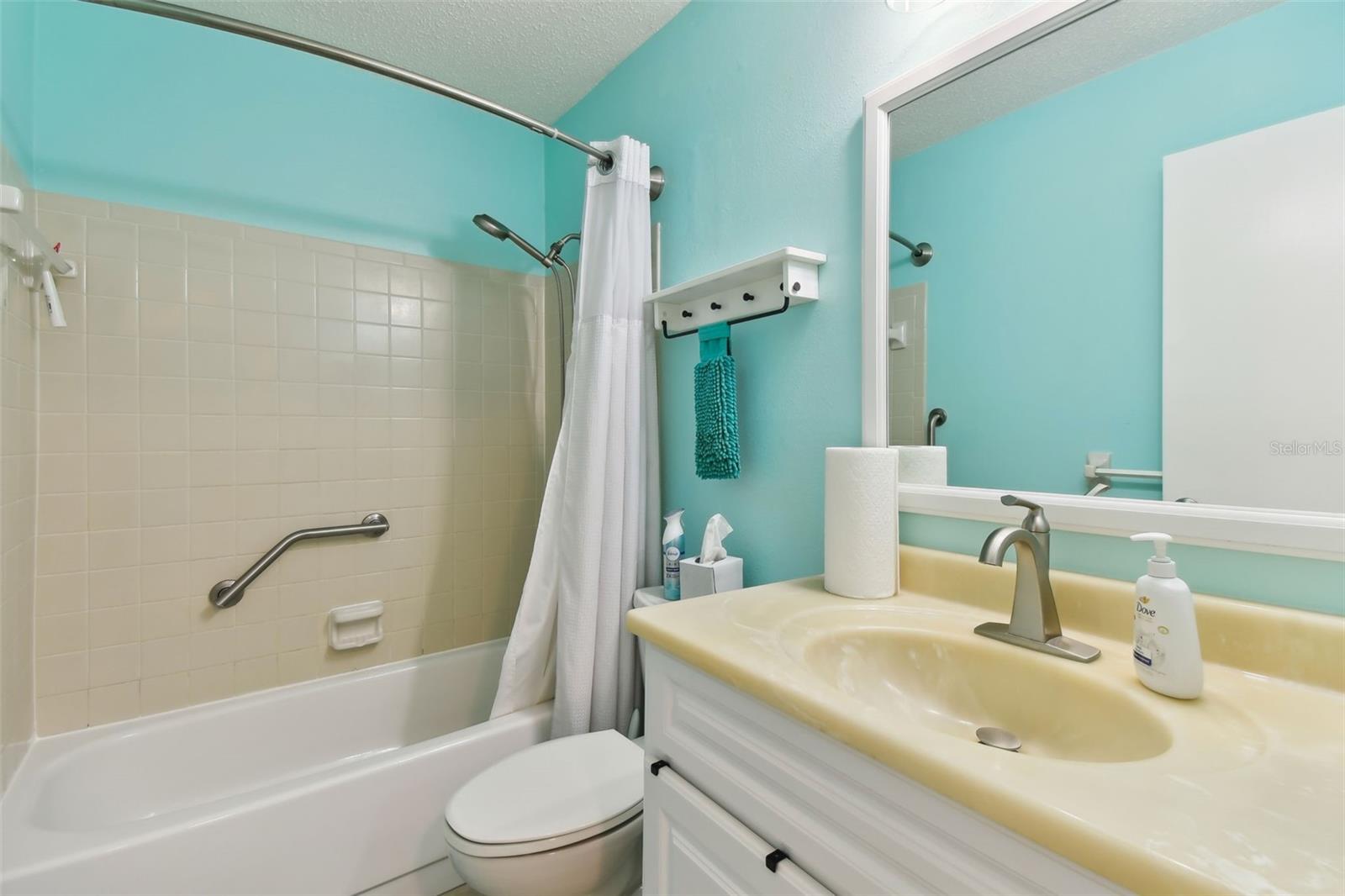 The drop ceiling has been taken out of this bathroom to make it feel bigger and more modern!