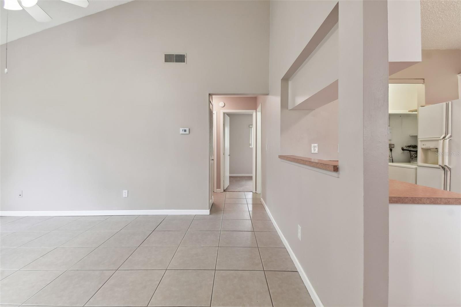 Walk in the front door into the living room with soaring vaulted ceilings