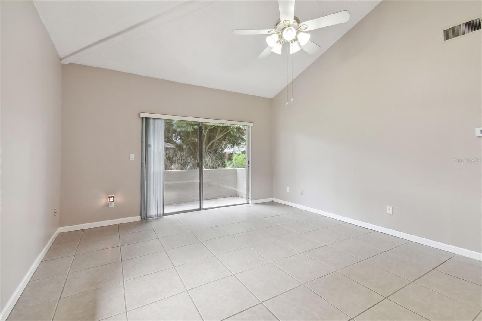 Another view of the living room looking out the back sliding doors.