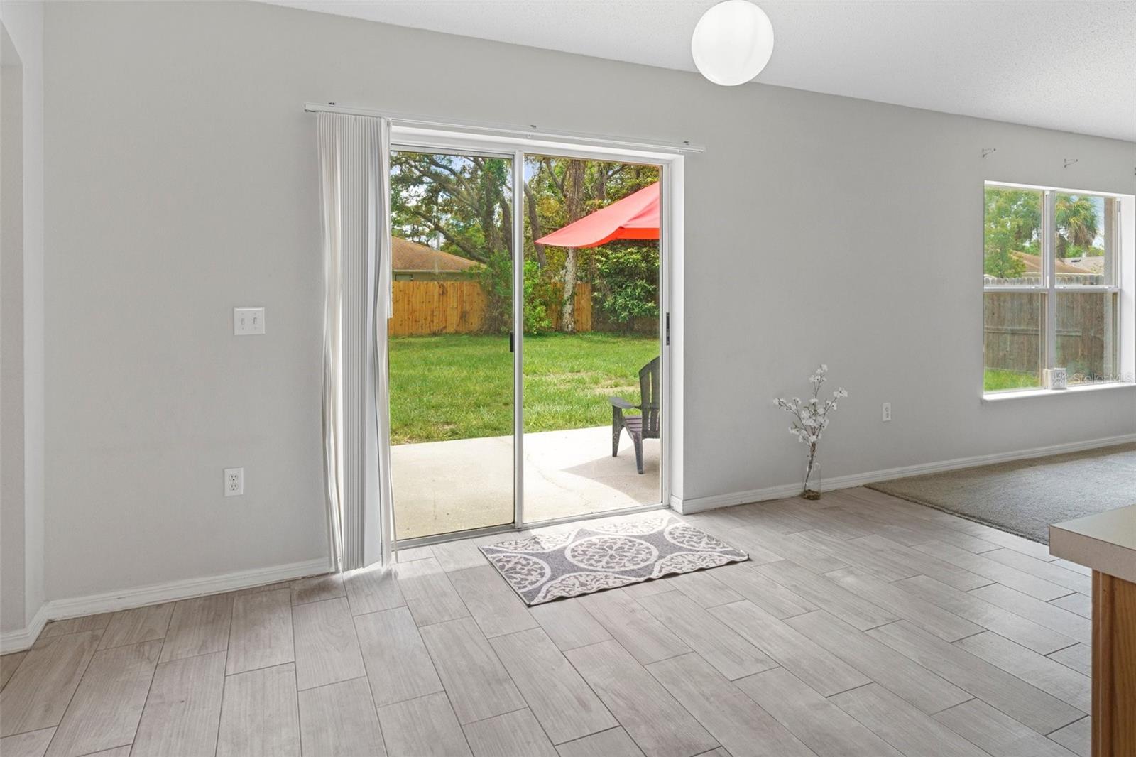 Eat In Kitchen Area with Sliders out to the Backyard