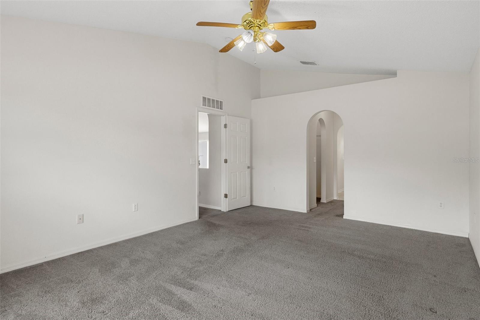 Arched hallway in the Master Bedroom  to the Master Bathroom and two walk in closets